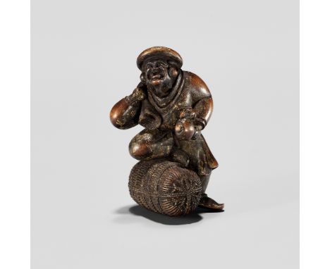 ITTOKUSAI: AN INTERESTING GOLD-LACQUERED WOOD OKIMONO NETSUKE OF DAIKOKUBy Ittokusai, signed Ittokusai 一徳齋Japan, 19th century