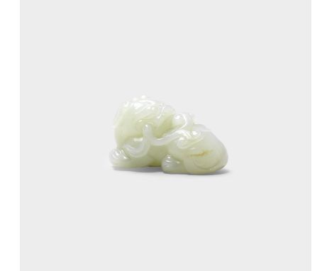 A VERY PALE GREEN JADE CARVING OF A MYTHICAL BEAST18th centuryThe pebble smoothly carved as a recumbent beast, the large head