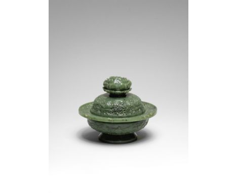 A FINE SPINACH-GREEN JADE 'EIGHT BUDDHIST EMBLEMS' OPENWORK INCENSE BURNER AND COVERQianlongOf compressed globular form suppo