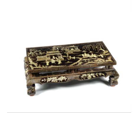 A MOTHER-OF-PEARL-INLAID BROWN LACQUER LOW TABLE, KANGPossibly Ryukyu Islands, 17th century With a flat rectangular top resti