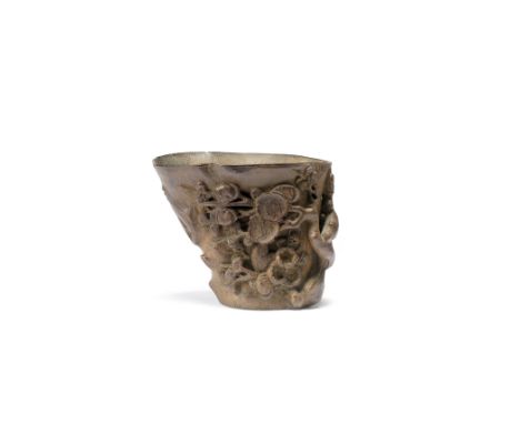 A BAMBOO 'PRUNUS' LIBATION CUP17th/18th centuryOf tapering naturalistic form, carved in relief with gnarled branches of dense