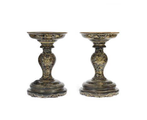 A PAIR OF GILT AND PAINTED BLACK LACQUER TAZZAS18th/19th century Each set on a carved bracket-rimmed base with five ruyi feet