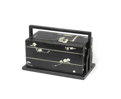 A BONE-INLAID BLACK LACQUER TWO-TIERED RECTANGULAR PICNIC BOX AND STANDKangxiThe cover decorated with an elegant lady and fem