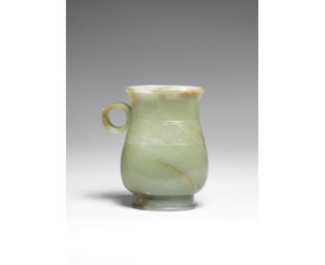 A RARE PALE GREEN AND RUSSET JADE VESSEL, ZHIMing DynastyThe pear-shaped body supported on a tall and slightly spreading foot