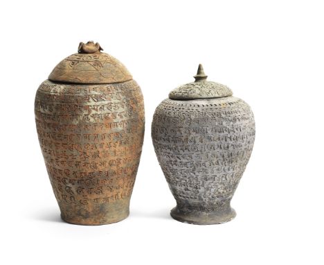 TWO RARE POTTERY 'SANSKRIT' JARS AND COVERSSong/Yuan DynastyThe taller baluster jar incised around the exterior with Sanskrit