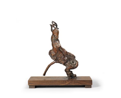 AN UNUSUAL ROOTWOOD CARVING OF A DEER18th centuryThe stocky animal naturalistically depicted striding with its fore legs and 