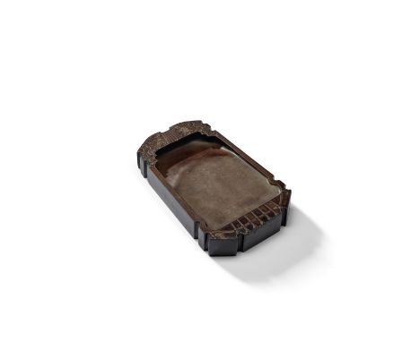 A GUQIN-SHAPED DUAN INKSTONEQing Dynasty Skilfully carved in the shape of a guqin of compressed proportions with a smoothly-c