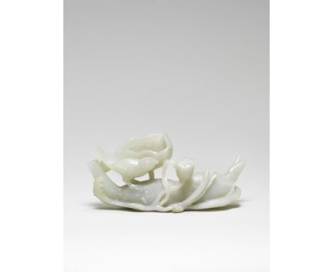 A PALE GREEN JADE CARVING OF A LOTUS ROOT AND BIRD18th century Finely carved in the form of a lotus root resting on a bed of 