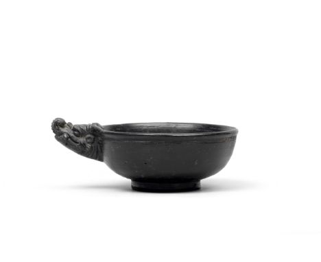 A RARE BLACK-GLAZED 'DRAGON' CUPYuan Dynasty The shallow vessel finely potted with rounded sides raised on a gently-flared fo