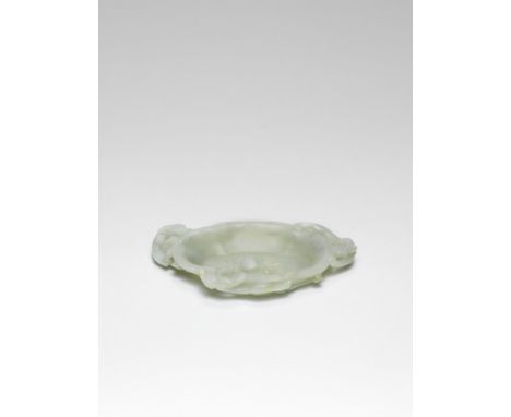 A PALE GREEN JADE 'CHILONG' BRUSH WASHER18th century  Carved as a shallow dish of quatrelobed shape with a flat base and thre