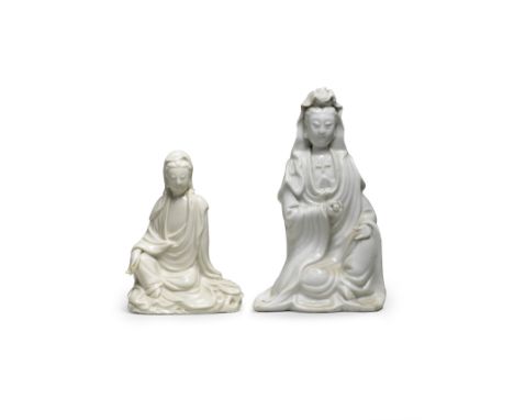 TWO BLANC-DE-CHINE FIGURES OF GUANYINKangxiEach dressed in elaborate flowing robes with a high cowl, one holding a scroll, th