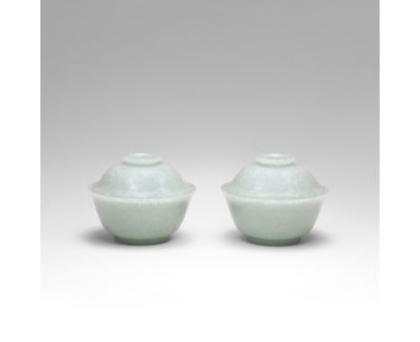 A FINE AND RARE PAIR OF JADEITE BOWLS AND COVERSQianlong Each bowl skilfully carved with generous rounded sides gently flarin