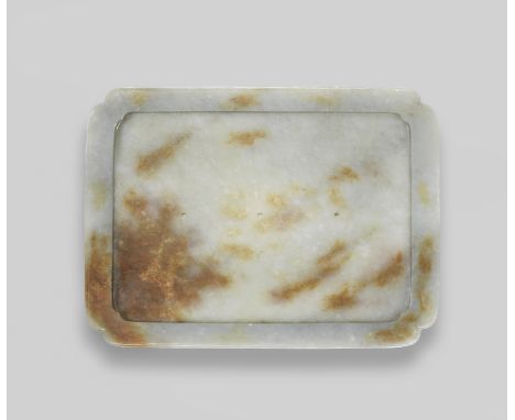 A PALE GREEN AND RUSSET JADE TRAY17th/18th centuryOf canted rectangular form, the sides with a raised band around the flatten