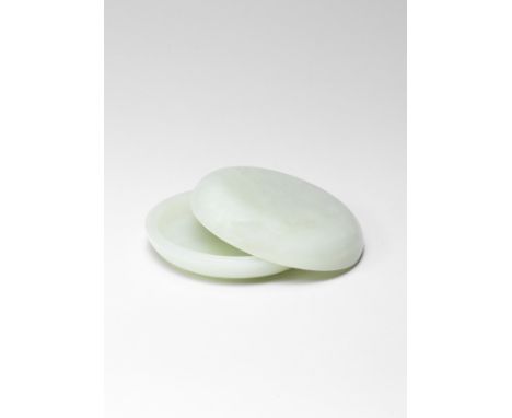 A PALE GREEN JADE CIRCULAR BOX AND COVERQianlong/JiaqingOf compressed form, supported on a short foot ring, the domed cover w