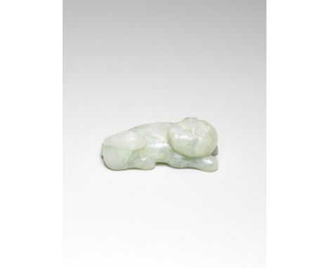 A PALE GREEN JADE CARVING OF A BUDDHIST LIONMing DynastySkilfully carved as a recumbent Buddhist lion with clawed feet, finel