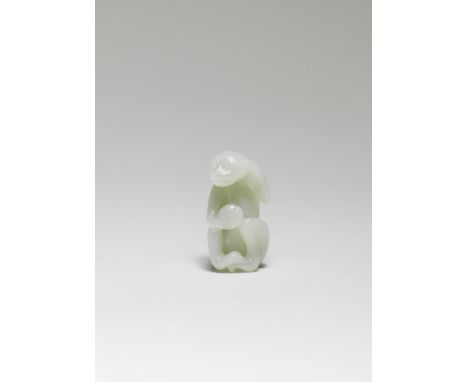 A WHITE JADE CARVING OF A MONKEY18th centurySmoothly carved as a mischievous monkey with a peach in his right hand, the left 