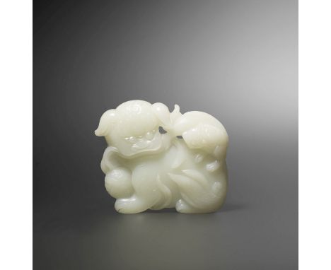 A WHITE JADE 'BUDDHIST LION AND CUB' BELT BUCKLE18th centuryCarved as a lioness and cub, the lioness with curly mane and a bu