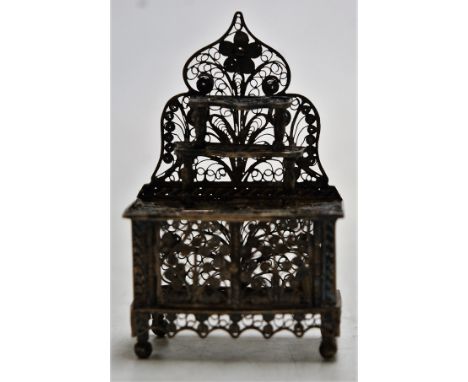 An early 20th century miniature white metal filigree worked model of a chiffonier, h.5.5cm