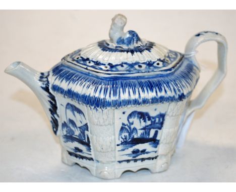An 18th century pearlware teapot, underglazed blue decorated (cover a/f)