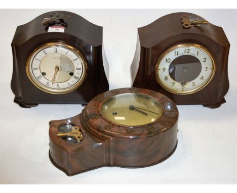 A 1950s Smiths bakelite cased mantel clock, the painted chapter ring having Roman numerals and eight day movement; together w