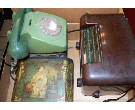 A box of miscellaneous items to include bakelite cased Bush radio, telephone lithograph tins etc