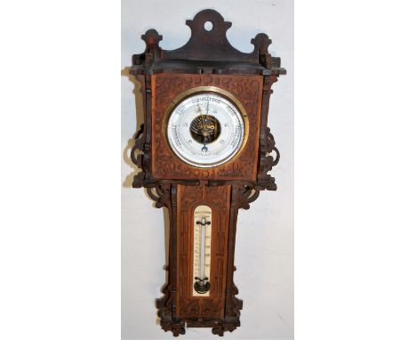 A circa 1900 fret carved wall barometer, 42cm