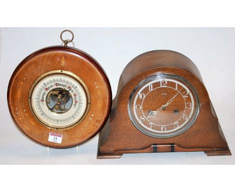 An Edwardian inlaid faded mahogany wall barometer of circular outline, 24cm, together with an Enfield oak cased mantel clock 