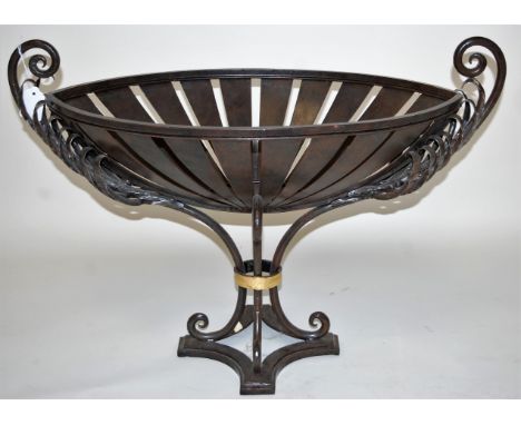 A contemporary cast iron boat shaped pedestal planter, having scroll arms and pierced oval body to scrolled feet, w.69cm