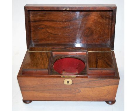 An early Victorian rosewood tea caddy, of sarcophagus form, the hinged lid revealing twin compartment fitted interior, the wh