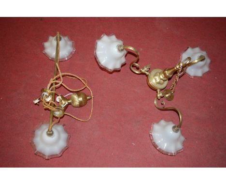 A 20th century brass three branch ceiling light fitting, having opalescent frilled glass shades; together with a rise and fal