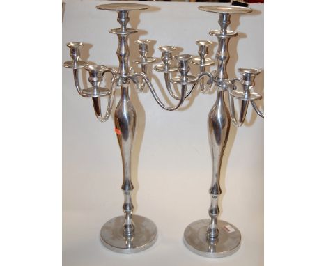 A pair of modern polished metal five light candelabra, 65cm