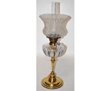 A Victorian oil lamp, having later etched frilled opalescent glass shade to a clear and cut glass font, on brass pedestal bas