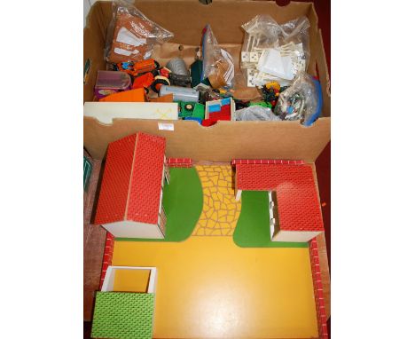 A box of various Britains and other farming vehicles and accessories, sold with a wooden scratch built model farmyard