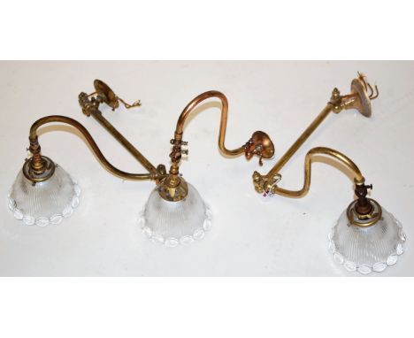 A pair of early 20th century adjustable brass single sconce wall light fittings, each having frilled clear glass shade; toget
