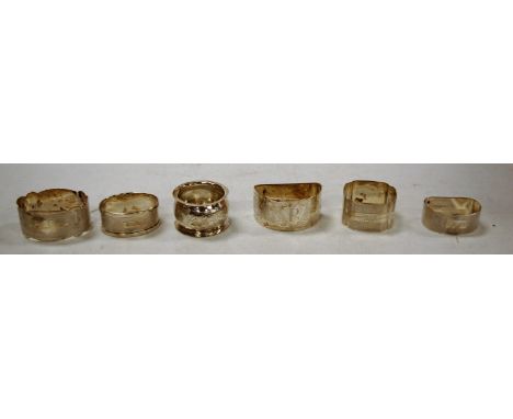 Six various silver napkin rings to include engine turned examples, 4oz