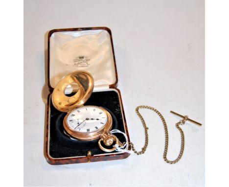 A gilt metal half hunter pocket watch, with white enamel dial, Roman numerals and black hands and subsidary seconds, inner ca