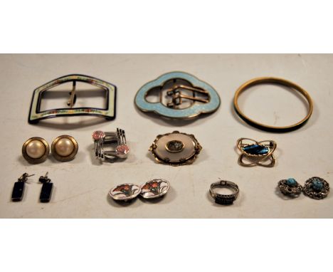A small quantity of jewellery to include two enamel buckles, a malachite bangle, a chalcedony and hairwork brooch, etc