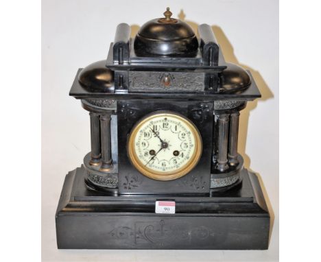 A circa 1900 black slate cased mantel clock of architectural form, having enamelled dial with Arabic numerals, eight day move
