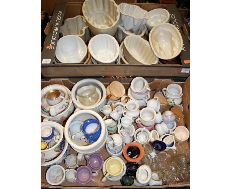 Three boxes of miscellaneous items to include modern Welsh love spoons, ceramic jelly moulds etc