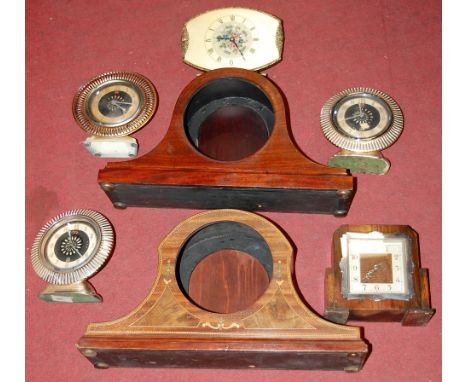 A 1950s oak cased mantel clock, the silvered chapter ring with Arabic numerals; together with two 1920s clock cases only, and