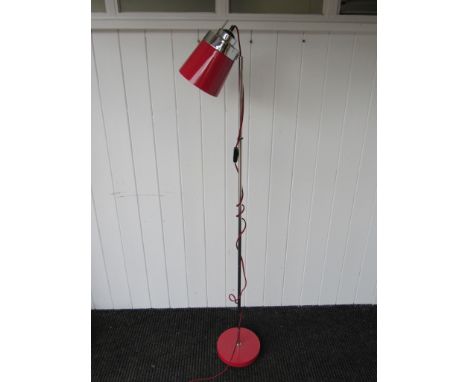 A contemporary retro style red metal and stainless steel floor lamp