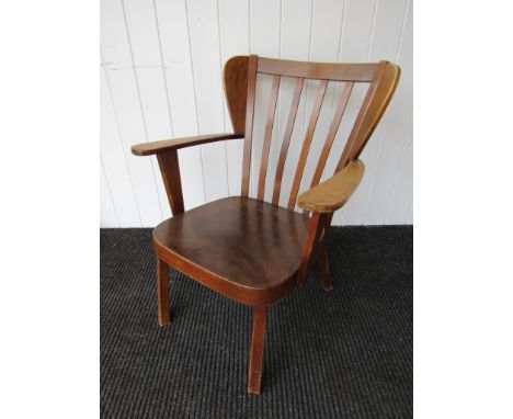 A 1940's Fritz Hansen armchair with winged slat back. FH mark underneath 