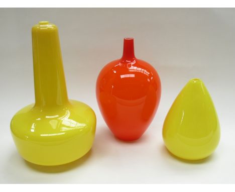 A group of three glass celing light shades in orange and yellow, tallest 39cm