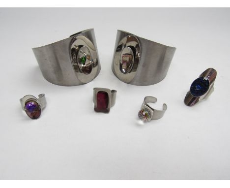 Four 1970's stainless steel bangles together with four similar vintage rings