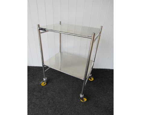 A vintage two shelf stainless steel trolley