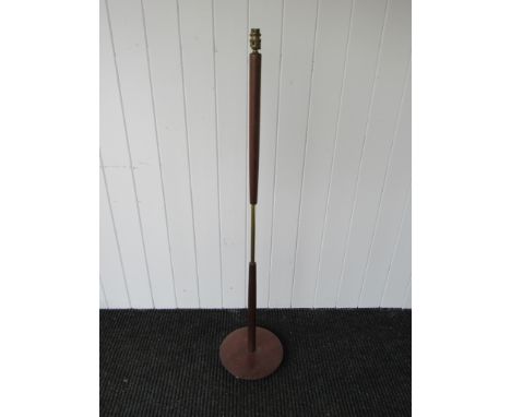 A teak and brass standard lamp 