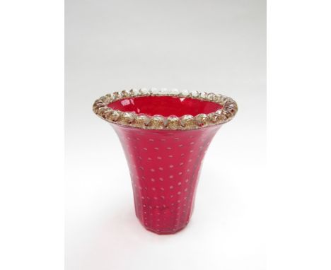 A 1950's Murano flared ruby glass vase with controlled bubble detail and clear rim with gold foil inclusions. 19cm high