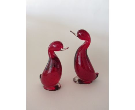 Two Whitefriars 'Dilly' ducks in ruby glass with bubble inclusions. 18cm & 15cm high
