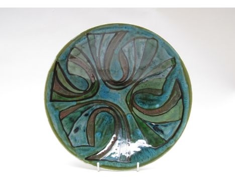 A Poole Studio bowl, green ground with blue abstract detail. Blue back stamp. 7cm high x 27cm diameter