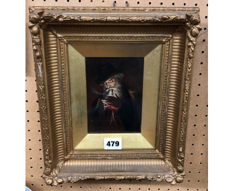 CONTINENTAL SCHOOL OIL ON BOARD STUDY OF A GENTLEMAN LIGHTING A PIPE F/G 19 X 15CM APPROX